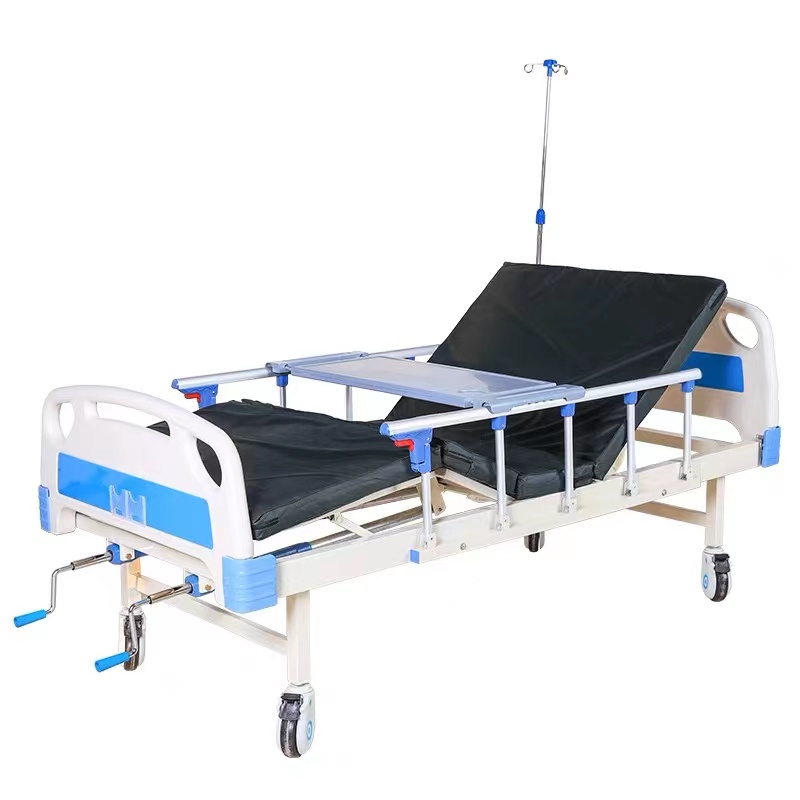 Cama de hospital de doble función ABS + colchón + barandilla + tabla de comedor + ruedas + soporte para infusiones